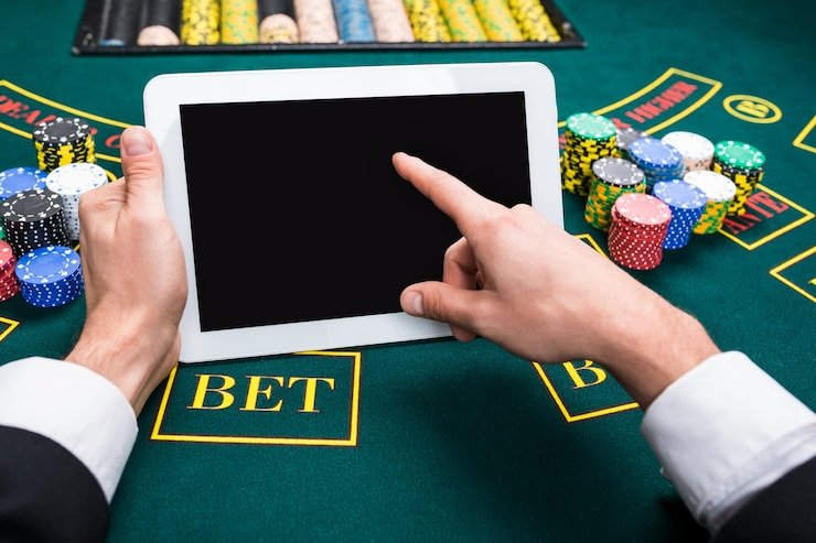 Live Sic Bo dealer with three dice in cup, ready to shake